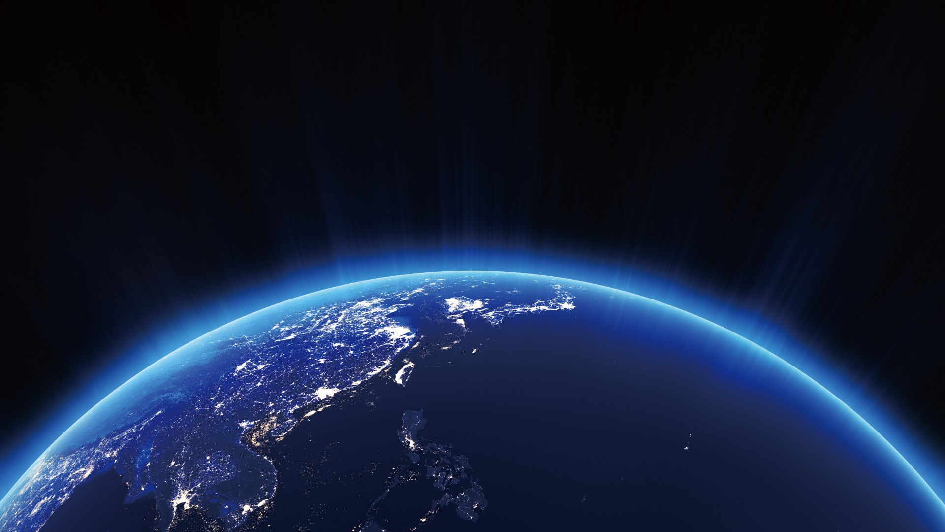 Earth seen from orbit: East Asia by night, dawn light on the horizon (Glacier Capital eighth-anniversary visual)