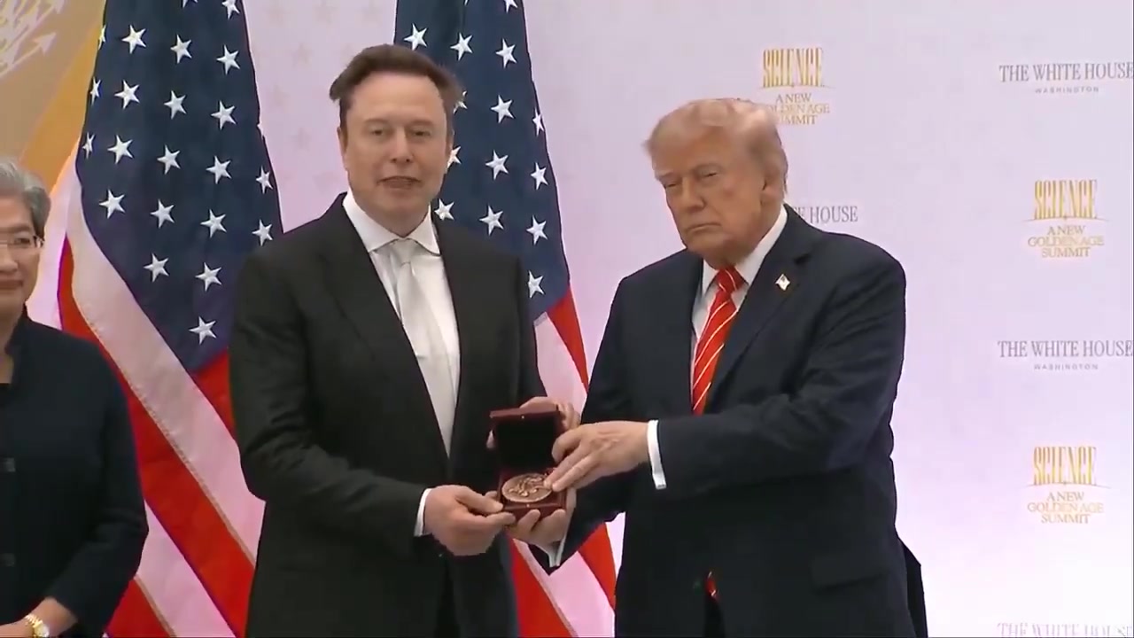 Donald Trump and Elon Musk holding the National Medal of Science; still from the official White House award video, 8 October 2026